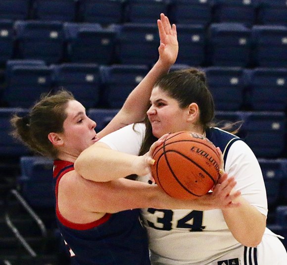 West Hills Golden Eagle Morgan Turner drives for the basket in win against College of the Sequoias Tuesday night in Lemoore.